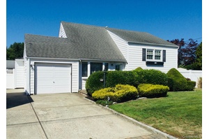 Ideally located split level home featuring 3 bedrooms, a full bath, living room, dining room, eat in kitchen, den, family room, and a separate laundry room with a convenient laundry ...