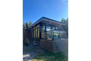 Welcome Home ! This Scandinavian inspired detached 2bedroom home sits on a quiet street surrounded by trees for ultimate privacy.