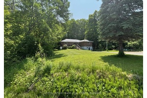 Three plus one bedroom bungalow on a beautifully treed, 3 4 acre lot within 15 minutes of Peterborough and close the Village of Warsaw.