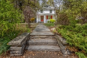 Nestled in Woodstock s storied Byrdcliffe district, this charming 1920 s home balances original character with modern comforts.