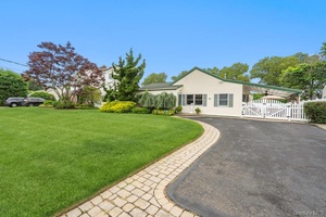 Discover the allure of this captivating Amityville residence, a perfect blend of character and modern updates nestled in a community you'll love.