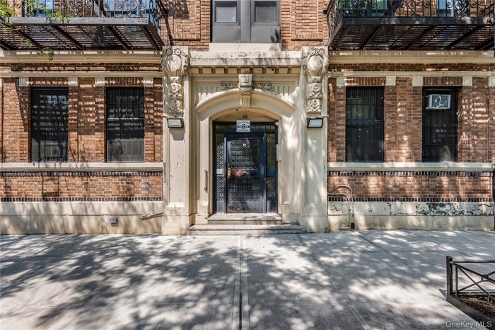 Entrance to property with brick siding