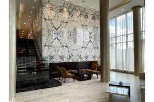 Luxury Living at Tridel Scala Elegant 1 Den, 2 Bath residence featuring a spacious open concept layout, soaring 9 ceilings, sleek laminate flooring amp ; a versatile den.
