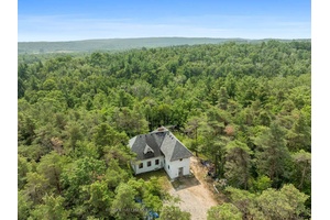 Discover over 100 acres of pristine mixed forest, complete with scenic hiking trails, hilltop panoramic views of the countryside, and bubbling natural springs and streams.