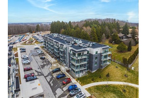 Premium 2 bedroom 2 bath condo in desirable Lackner Woods with private balcony overlooking evergreens.
