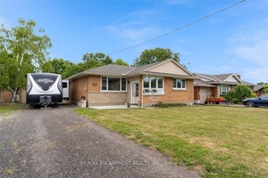 Welcome to 5073 Charles Street, a warm and inviting 3 1 bedroom bungalow nestled on a lovely deep sized lot in Beamsville.