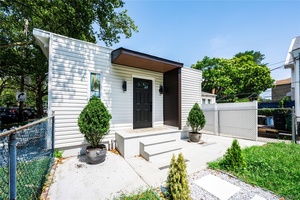 This charming, beautifully renovated single family home is situated on a lovely corner lot measuring 25 x 100.