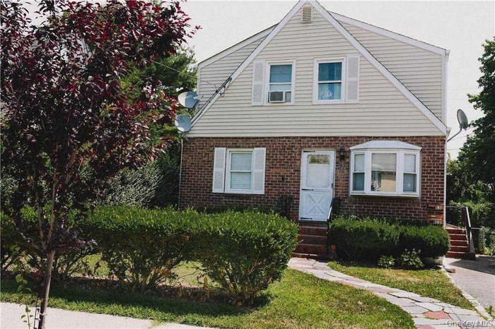 View of front facade featuring brick siding