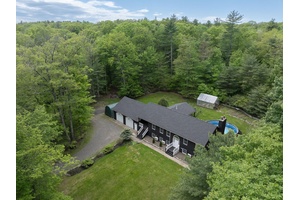 Nestled on a serene country road, this turnkey, beautifully maintained home offers exceptional comfort, privacy, diverse living spaces, and a host of modern updates ideal for relaxed living.