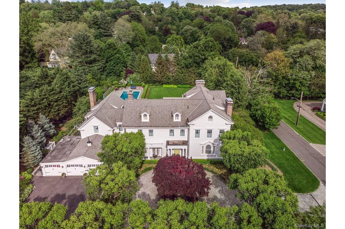 Resort style set on an acre of meticulously manicured property in Ardsley Park!