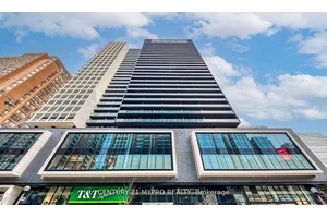 Partial Furnished 2 Bedroom Unit including bed in each room and desk in the smaller room.