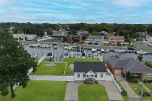 Discover this waterfront ranch, perfectly positioned for both comfort and investment.
