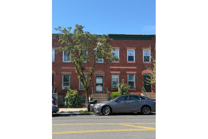 View of front of house featuring brick siding