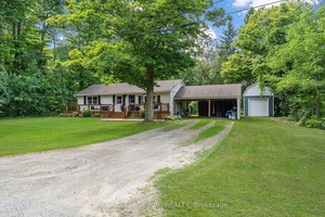 Welcome to 445 Gloria Road, a charming bungalow tucked away in a peaceful, wooded setting in Ridgeway.