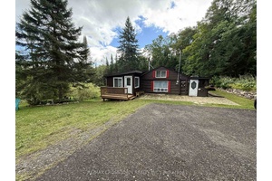 Welcome to this charming 2 1 bedroom log home, perfectly located on 5 private acres just 10 minutes from Prospect Lake and close to Hwy 118 and Hwy 11 !