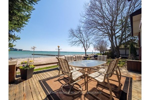 Situated directly on Gravelly Bay, this waterfront property offers lovely views of Lake Erie, the Port Colborne lighthouse, Sugarloaf marina, and the entrance to the Welland Canal.