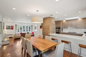 Welcome to this beautifully maintained ranch, perfectly set on a private quarter acre corner property in Glen Cove.