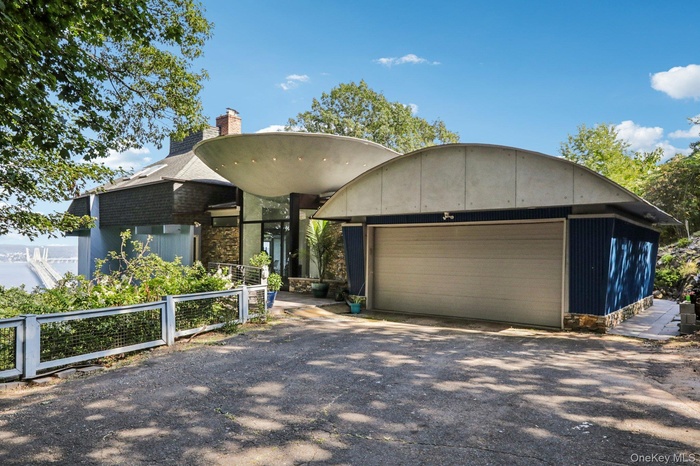 View of front of property featuring a chimney