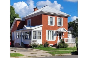 Amazing investment property or opportunity for multi generational living in this solid brick, low maintenance, legal duplex.