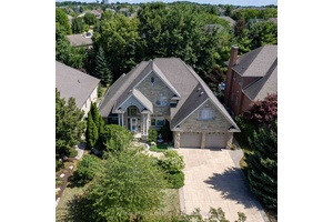 Welcome to 215 Black Maple Court, a fully reimagined custom bungaloft that unites French inspired design with refined, modern living.