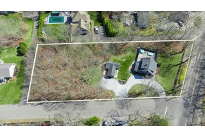 This is just over an acre with TWO houses on it.