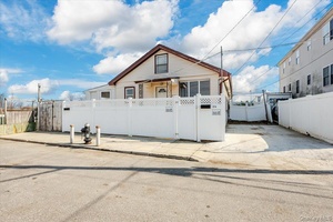 Legal 2 family with 2 separate cottages each 888 sqf nestled on 1 lot on a quiet dead end block facing the breathtaking view of the bay with private beach ...