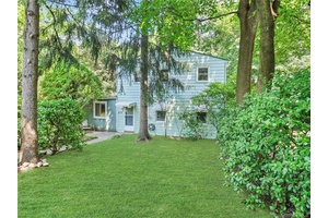 Spacious 4 bedroom single family home in Nanuet with a very private lot and 4 car parking.