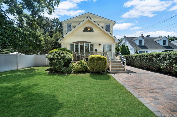 View of front of house with a fenced backyard