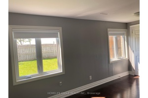 This legal walk out unit feels more like a main floor apartment, its above ground location filled with natural light, and features large windows throughout.