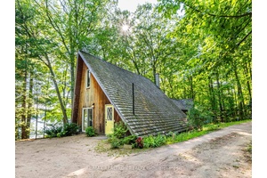 Welcome To This Charming And Versatile Waterfront Property On A Premium 160ft Lot !