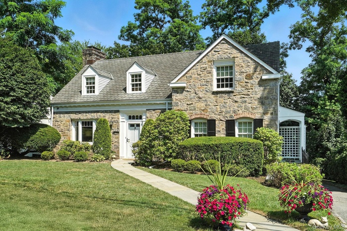 As seen from the street, this Cape Colonial home is full of charm.