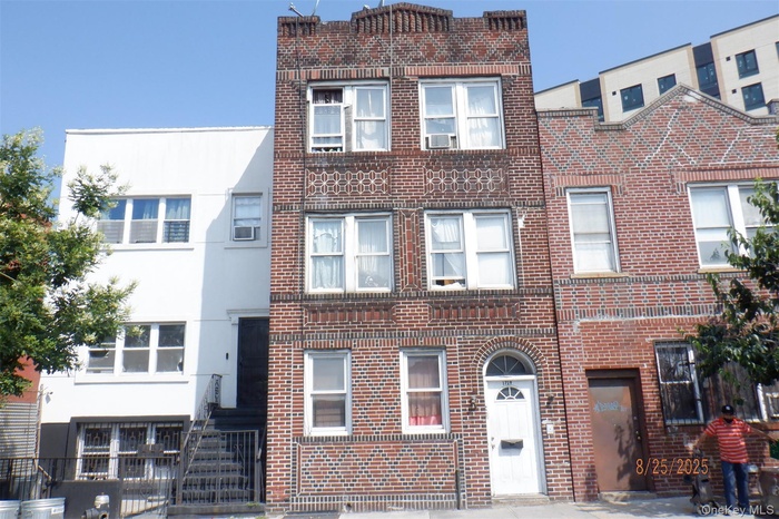 Triplex 3 Family  featuring brick siding