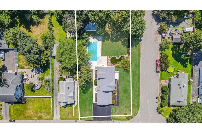 Aerial view of residential area with property boundaries highlighted