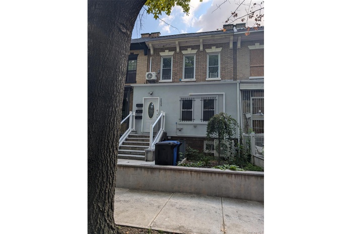 View of front of property with brick siding