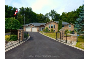 Welcome to this exceptional all brick bungaloft, offering the perfect blend of style, space, and flexibility all nestled on a beautifully landscaped 1 acre lot.