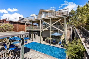 Soaring high above the dune and offering panoramic ocean views in every direction, this iconic octagon houses a classic example of Pines mid century architecture.