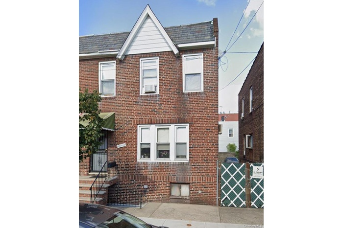 Traditional home with brick siding
