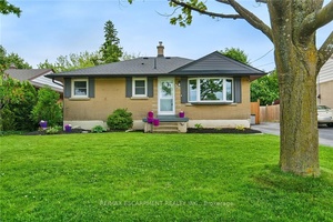 This charming bungalow sits on a generous 49 x 100 lot and offers approximately 1, 800 square feet of living space.