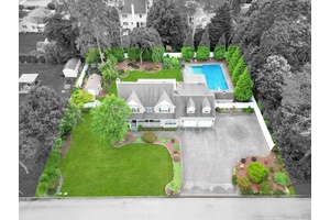 Incredible opportunity to own a beautifully built colonial tucked midblock in a quiet cul de sac on just under a half acre, where curb appeal meets resort style living.