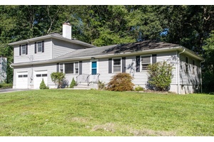 What was once a modest sized ranch has been transformed into 2140 square feet of versatile living space offering five bedrooms ; three of which would make great primary bedrooms.