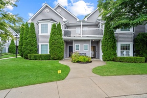Welcome to 303 O'Keefe Court, a well appointed first floor condo located in the desirable Oak Creek Commons Development.