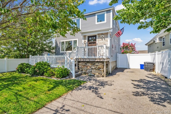 View of front of property featuring a deck