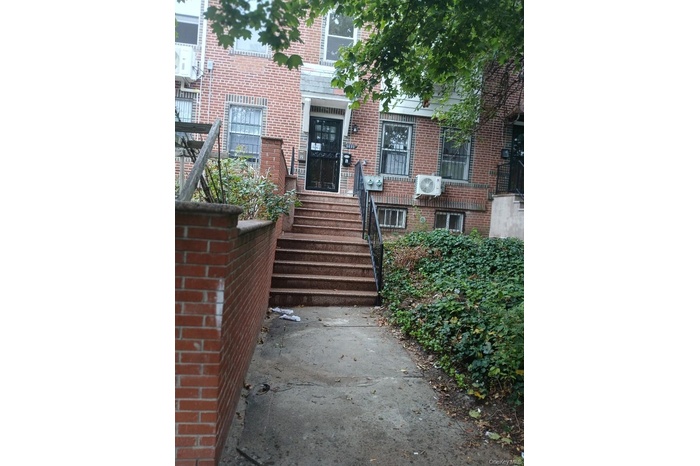Entrance to property with brick siding