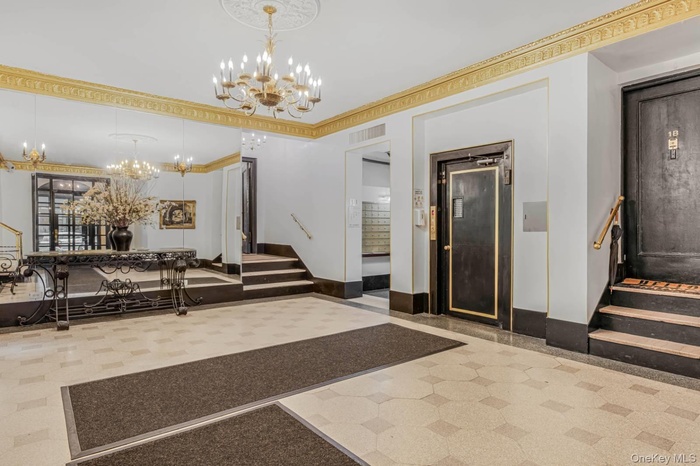 Common area featuring stairway and crown molding