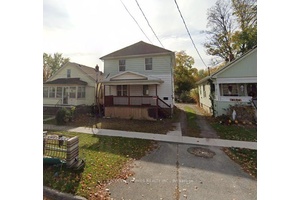 Close To Public School And High School This Two Story Family Home Feature 6 bedroom 3 washroom house with 3 car parking.