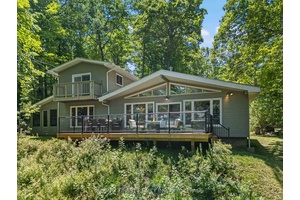 This 1890 sq ft custom built, year round 5 bedroom, 2 bath home on the pristine shores of Thirteen Islands Lake.