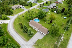 Just minutes from Buckhorn, this beautifully maintained raised bungalow blends nature, comfort, and room to gather.