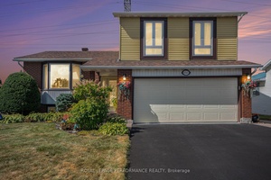 Beautiful Side Split Level in Pineview backing on walking trails with an inground heated pool surrounded by a stunning landscaped and well maintained yard.
