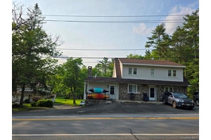 Turnkey Investment Opportunity 6 Unit Income Property on 6 Acres with Pond.
