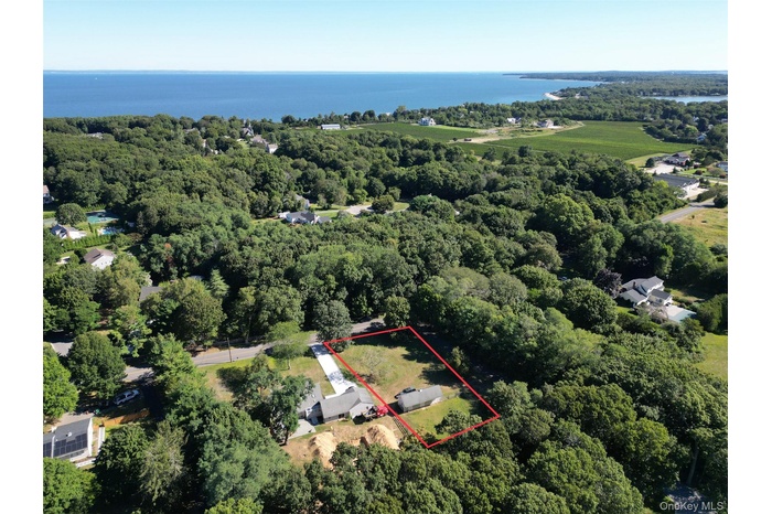 View of property location featuring property parcel outlined and a nearby body of water